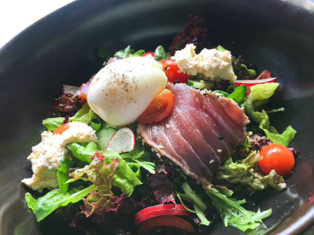 Close-up shot of healthy Japanese Tuna Salad ( leaf vegetable with raw tuna slices )
