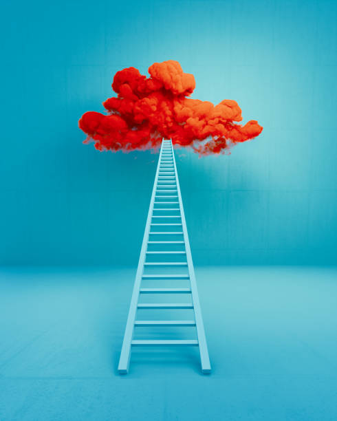 Blue ladder leaning onto a red cloud over blue background. Getting away from it all concept.