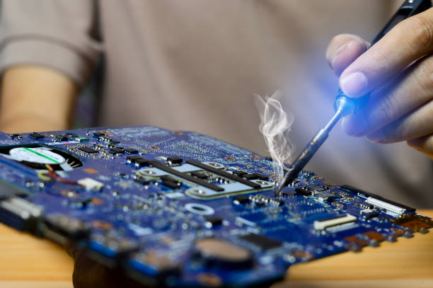 istock Technician concept repairing computer motherboard, soldering circuits 2152055951