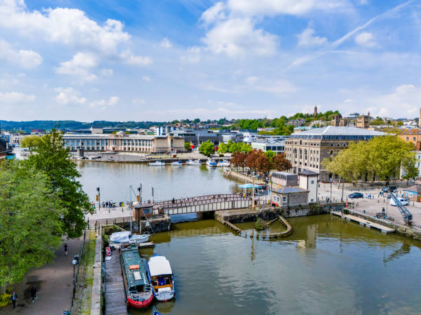 Bristol, UK. 7 May 2024. People crossing Prince Street Bridge in Bristol