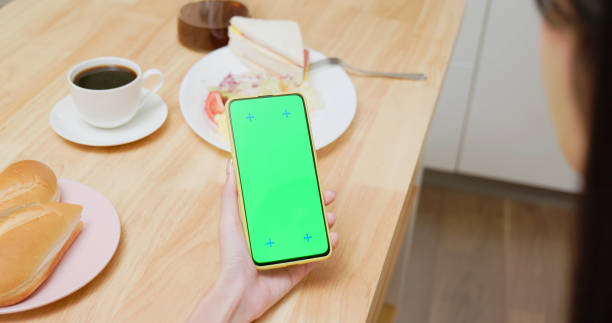 istock Asian woman smartphone by table 2152055980