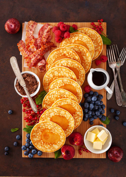 istock american pancake board with bacon berries maple syrup butter 2152062938