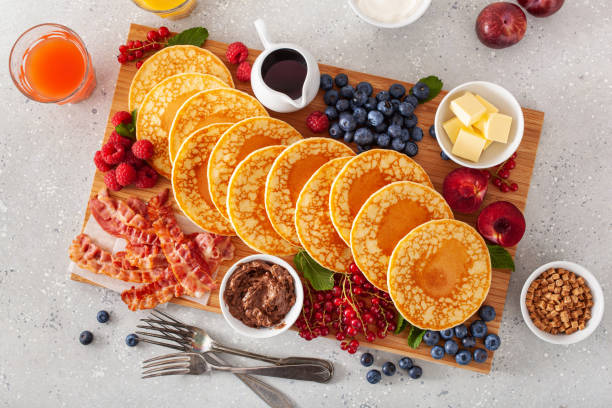 istock american pancake board with bacon berries maple syrup butter 2152063471