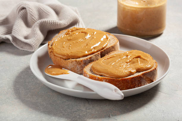 istock smooth peanut butter bread toast, healthy traditional sandwich 2152063640
