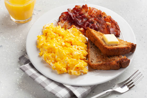istock traditional scrambled egg breakfast with bacon and toast 2152063747