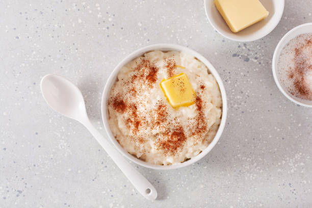 istock rice pudding with butter cinnamon. french riz au lait, norwegian risgrot, traditional breakfast dessert 2152064074