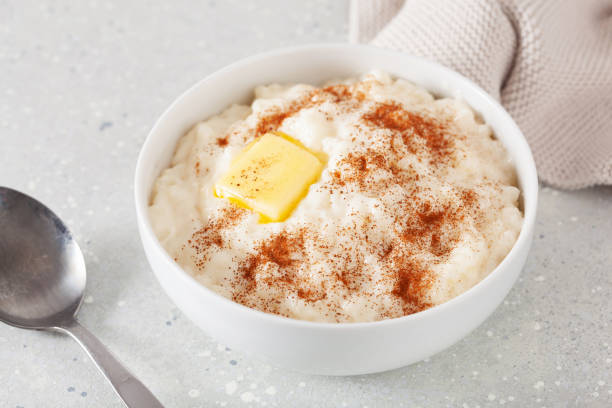istock rice pudding with butter cinnamon. french riz au lait, norwegian risgrot, traditional breakfast dessert 2152064096