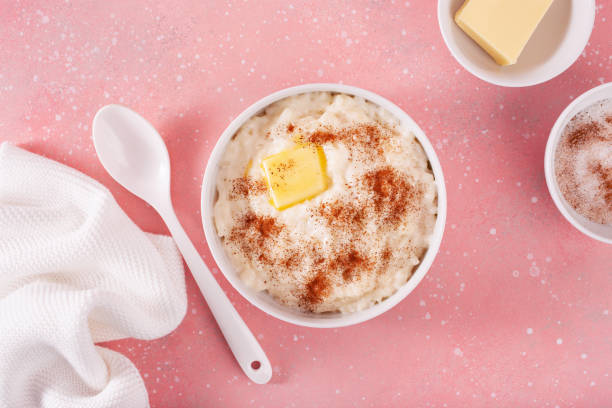istock rice pudding with butter cinnamon. french riz au lait, norwegian risgrot, traditional breakfast dessert 2152064111