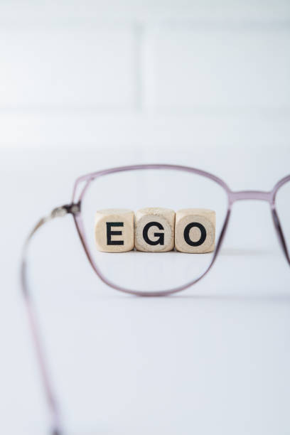 istock Cubes forming the word ego viewed through a lens 2152064231