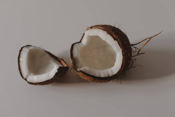 istock opened coconut pieces isolated on white background 2152066814