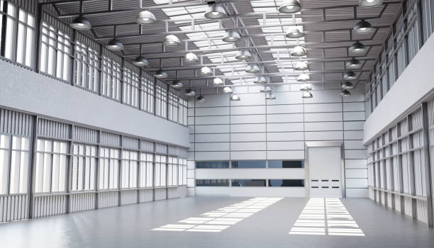 istock An empty light warehouse. Warehouse room with windows on the roof. Building for production. 2152070492