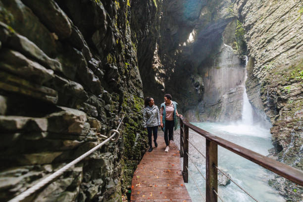 istock Female Friends Exploring Kozjak Waterfall 2152070736