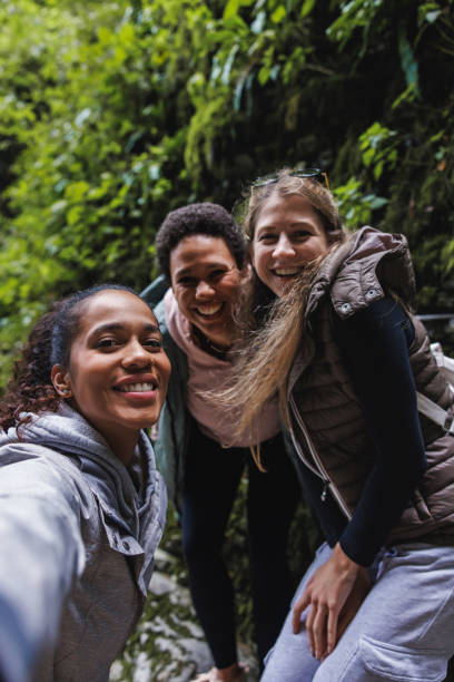 istock Female Friends Enjoying Nature on a Forest Hike 2152070741