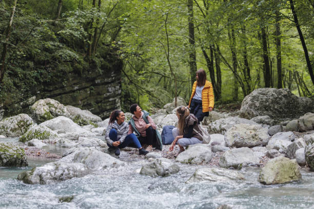 istock Female Friends Enjoying Nature on a River Hike 2152070758
