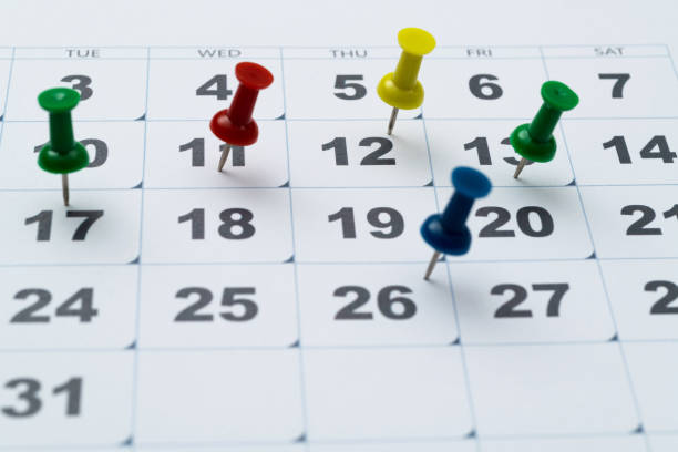 istock Thumbtack pins on a calendar 2152071420
