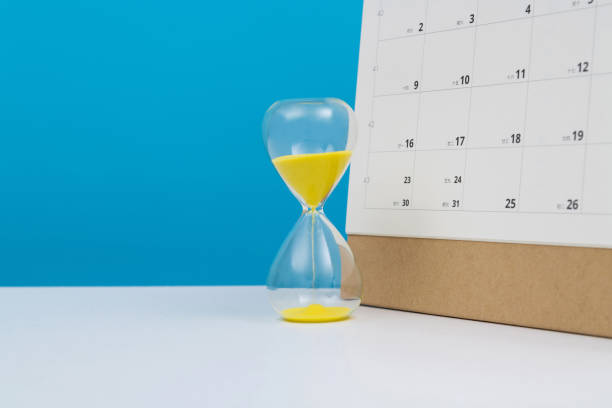 istock Calendar and hourglass on the table 2152071436