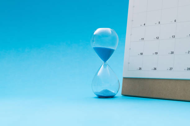 istock Calendar and hourglass on blue background 2152071440