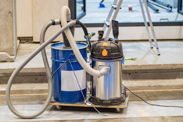 istock Industrial vacuum cleaner. Trolley with vacuum cleaner and additional capacity. Construction site cleaning equipment. Industrial vacuum cleaner in room being renovated. Equipment for industrial work 2152072569