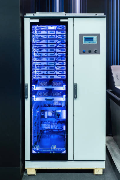 istock Server equipment. Cabinet with telecommunications equipment. Servers with wires for production automation. Modern telecommunications equipment. Telecommunication tech. Server cabinet with neon glow 2152072619