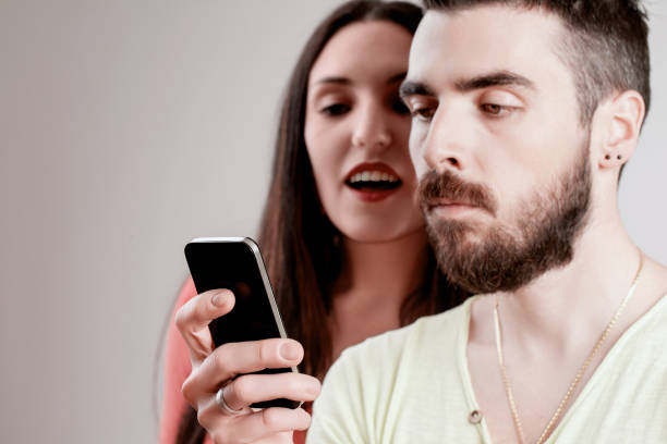 istock Curiosity fights privacy, woman checks his messages 2152074200
