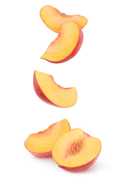 istock Pieces of falling fresh peach isolated on white 2152075552