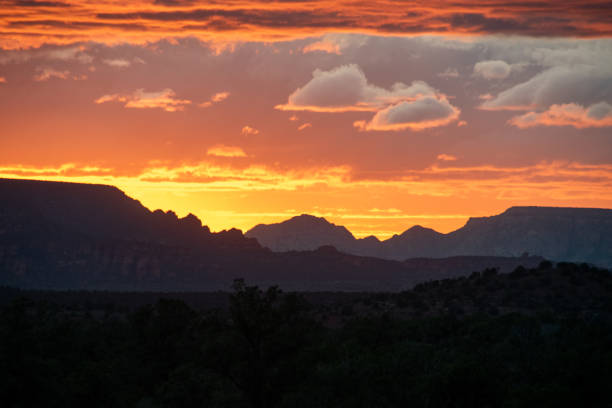 Sedona's stone mountains, characterized by their vivid red sandstone formations and towering cliffs, create a striking contrast against the desert landscape. These natural monuments dominate the horizon with steep ridges and dramatic buttes, providing a rugged yet beautiful environment for exploration.
