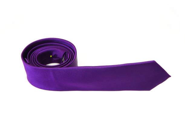istock A purple color polyester fabric necktie rolled on white background close-up view single object concept no people 2152081740