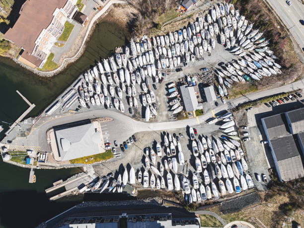 Boats in a yard, wrapped up for winter.