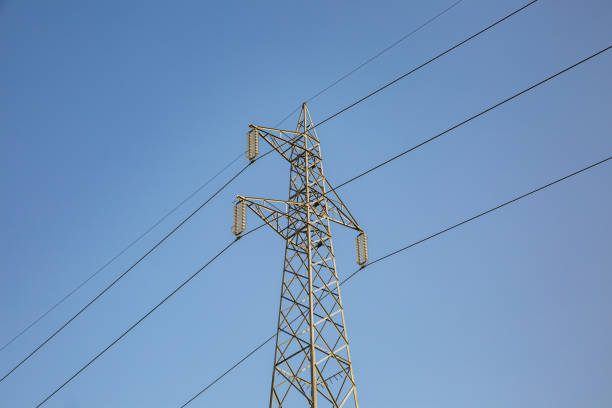 Electricity transmission pylon on sky background.