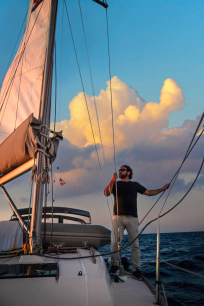 istock Sailor watching the environment on a sailboat. 2152095787
