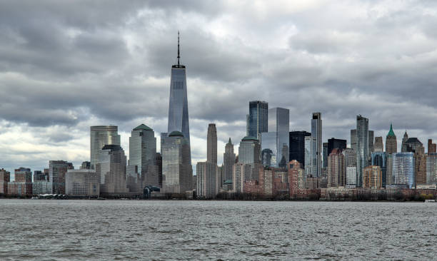 istock downtown manhattan skyline on a cloudy day (world trade center) one skyscraper tall buildings (financial center) hudson river, liberty state park view new york city nyc metropolis cityscape 2152096516