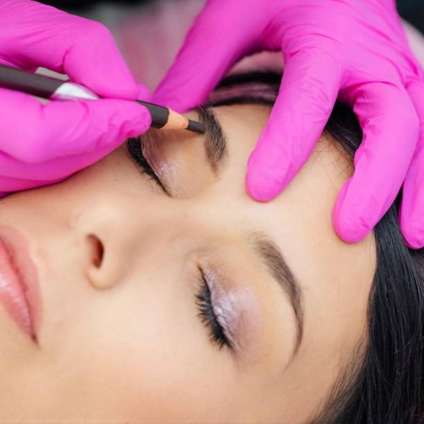 istock Powder brows treatment in a Spa saloon - closeup 2152096550