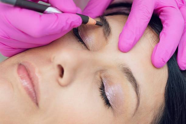 istock Powder brows treatment in a Spa saloon - side view 2152096556
