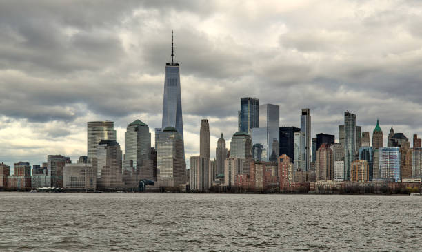 istock downtown manhattan skyline on a cloudy day (world trade center) one skyscraper tall buildings (financial center) hudson river, liberty state park view new york city nyc metropolis cityscape 2152096577