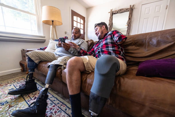 istock Disabled hispanic veteran amputees hanging out at home 2152102547