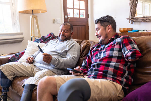 istock Disabled hispanic veteran amputees hanging out at home 2152102606