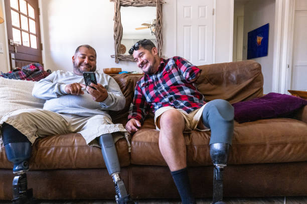 Disabled hispanic veteran amputees hanging out at home