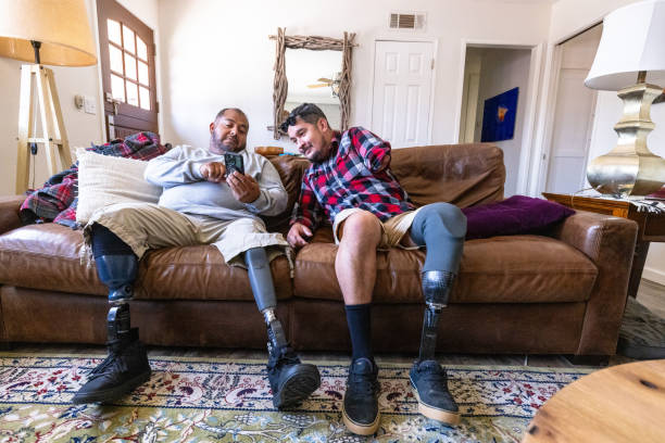 istock Disabled hispanic veteran amputees hanging out at home 2152102797