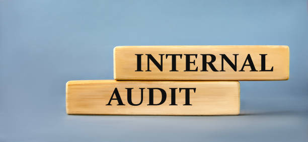 istock INTERNAL AUDIT - words on wooden blocks on blue background 2152112994