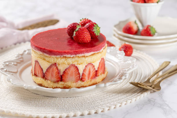 istock Fraisier mousse cake. Strawberry cake with sponge cake, mousse and jelly on a marble table. 2152113382