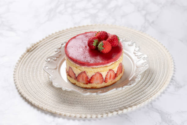 istock Fraisier mousse cake. Strawberry cake with sponge cake, mousse and jelly on a marble table. 2152113422
