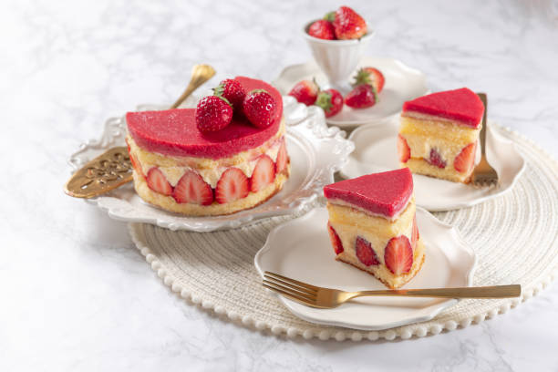 istock Fraisier mousse cake. Strawberry cake with sponge cake, mousse and jelly on a marble table. 2152113429