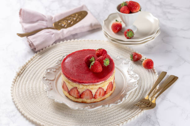 istock Fraisier mousse cake. Strawberry cake with sponge cake, mousse and jelly on a marble table. 2152113457