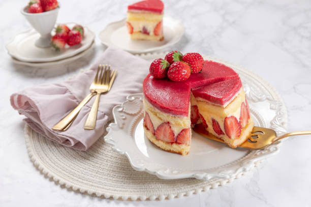 istock Fraisier mousse cake. Strawberry cake with sponge cake, mousse and jelly on a marble table. 2152113489