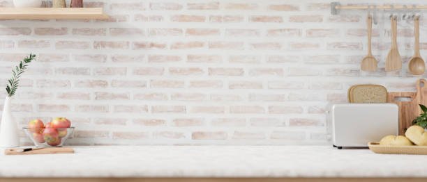 istock A display space on a white kitchen tabletop with minimalist kitchen utensil against the brick wall. 2152119867