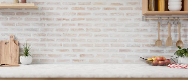 istock A space on a white kitchen tabletop with minimalist utensil and decor against the brick wall. 2152119868
