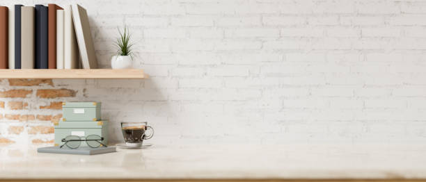 istock A space for showcase products on a white tabletop with objects against the rustic white brick wall. 2152119902