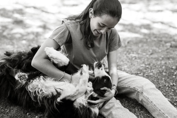 istock Hispanic girl hugging her dog 2152126282