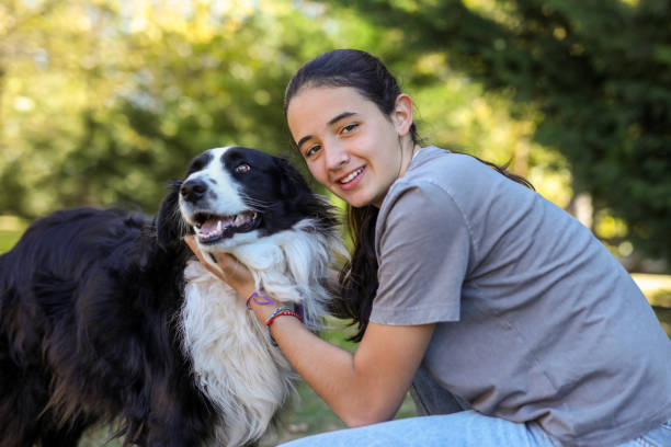 istock Hispanic girl hugging her dog 2152126288