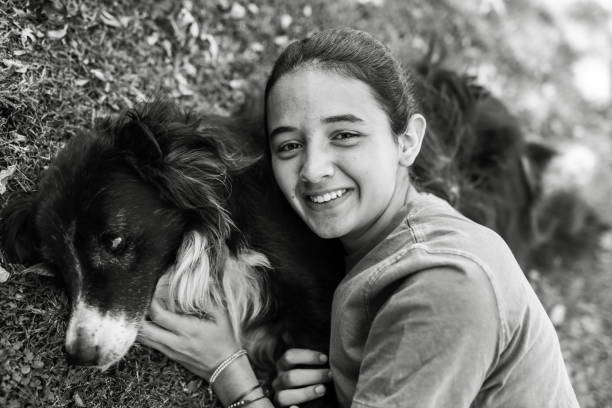 Hispanic girl hugging her dog - Buenos Aires - Argentina